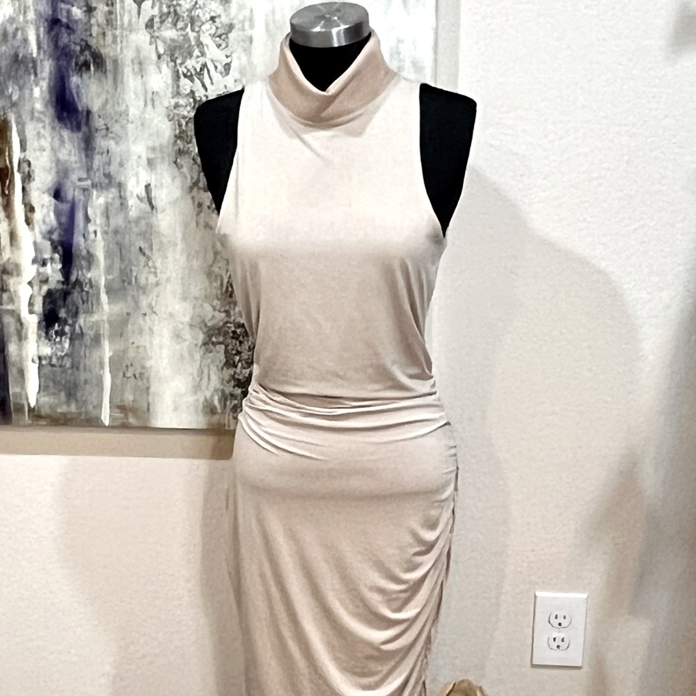 Tan midi mock neck dress with side ruching and exposed zipper at neck